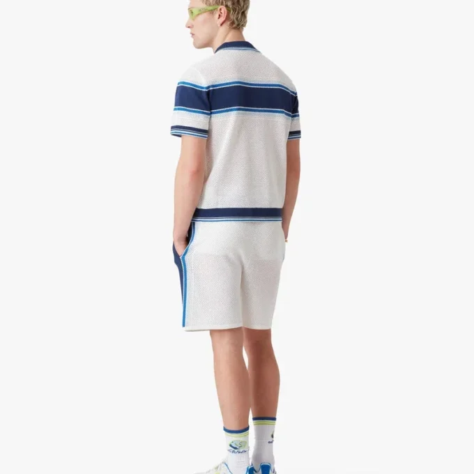 Hvid og blå stribet mesh-poloshirt med korte ærmer