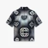 Perlemorsfarvet Monogram-denimskjorte med korte shorts
