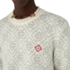 Sølvfarvet monogram i mohairblanding med rund hals Sølvfarvet monogram i mohairblanding med rund hals