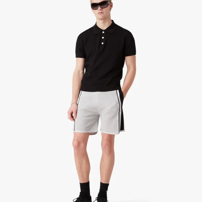Sort kortærmet poloshirt med pointelle-monogram Sort kortærmet poloshirt med pointelle-monogram