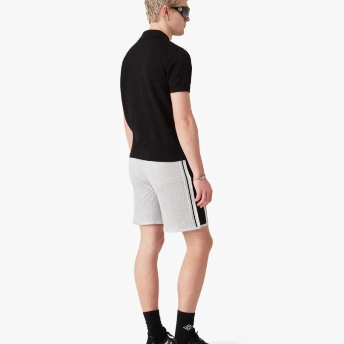 Sort kortærmet poloshirt med pointelle-monogram Sort kortærmet poloshirt med pointelle-monogram